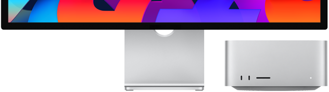 Hình ảnh cận cảnh mặt trước của Mac Studio bên cạnh Studio Display. Mac Studio nằm gọn bên dưới cạnh dưới của Studio Display.